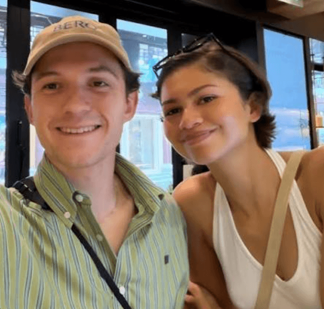 Tom Holland and Zendaya posing together during their Shanghai visit
